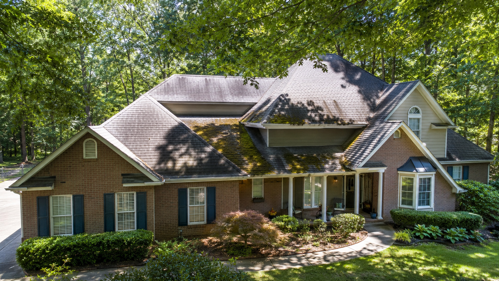 Peachtree City home with tree canopy — moss and algae risk on shaded roof sections